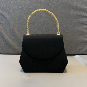 Elegant Black Handbag with Gold Handle
